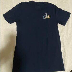 Navy blue t shirt with fish tail decal above chest pocket